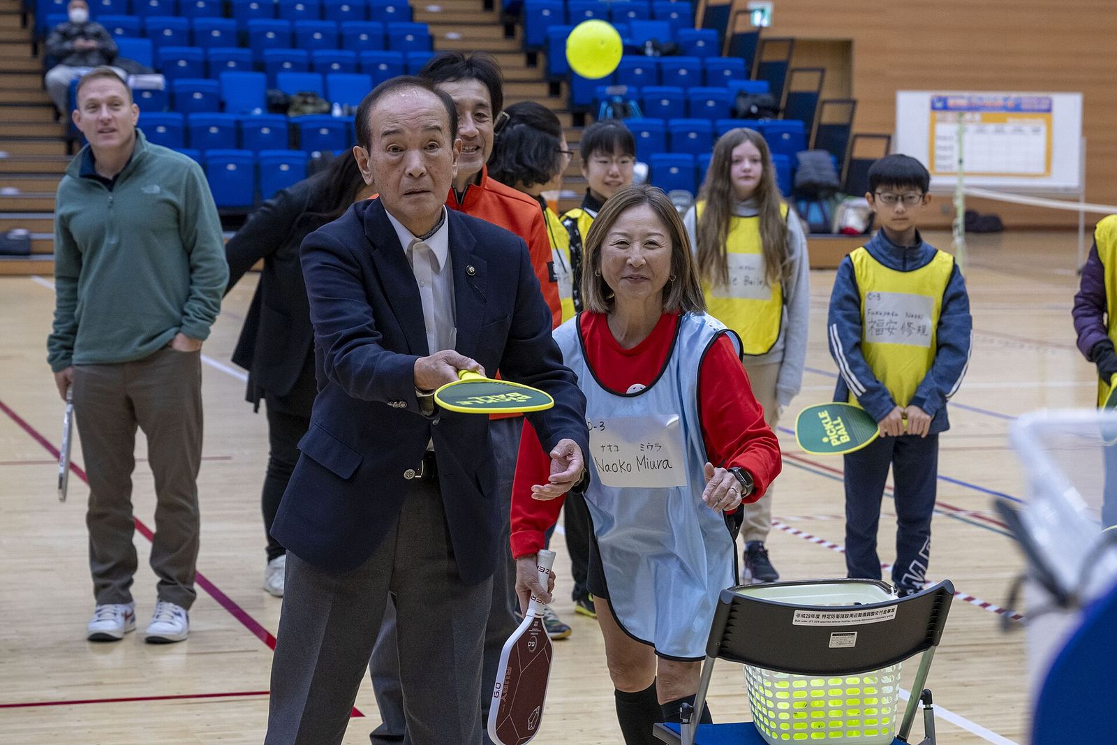 Players of all ages take part in a community pickleball event